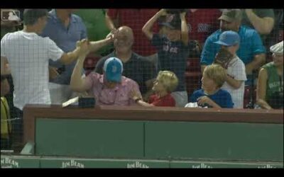 WHAT A CATCH! Red Sox fan barehands a foul ball with a chicken finger in his mouth at Fenway Park.