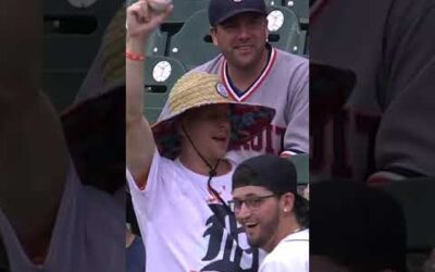 Nice catch, Dad! This HR was caught barehanded by a dad holding a baby!